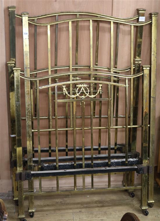 A pair of Edwardian brass single beds